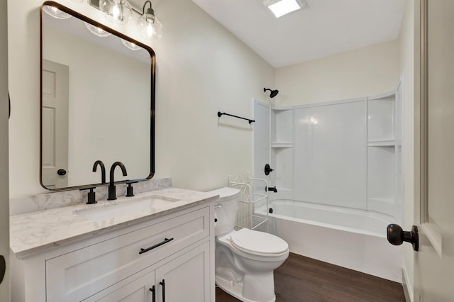 full bathroom featuring vanity, toilet, bathtub / shower combination, and hardwood / wood-style floors