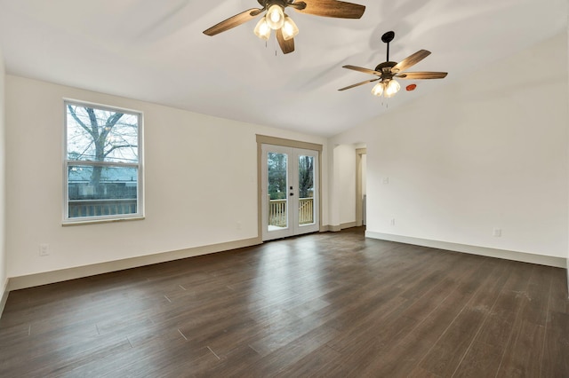 spare room featuring dark hardwood / wood-style flooring, lofted ceiling, and french doors