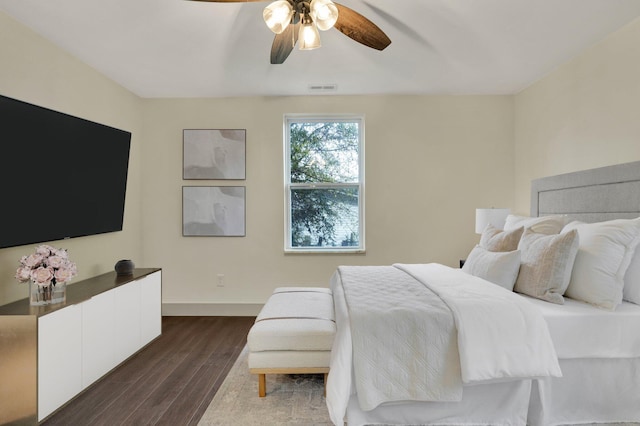 bedroom featuring ceiling fan and dark hardwood / wood-style flooring