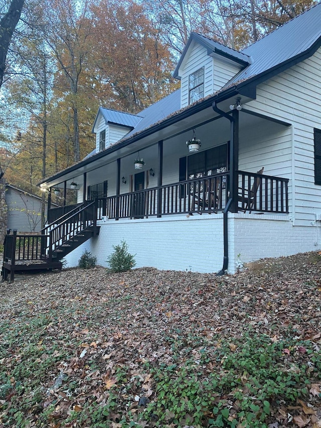 view of home's exterior featuring covered porch