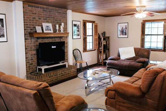 living room with ceiling fan, wooden ceiling, ornamental molding, and a wealth of natural light