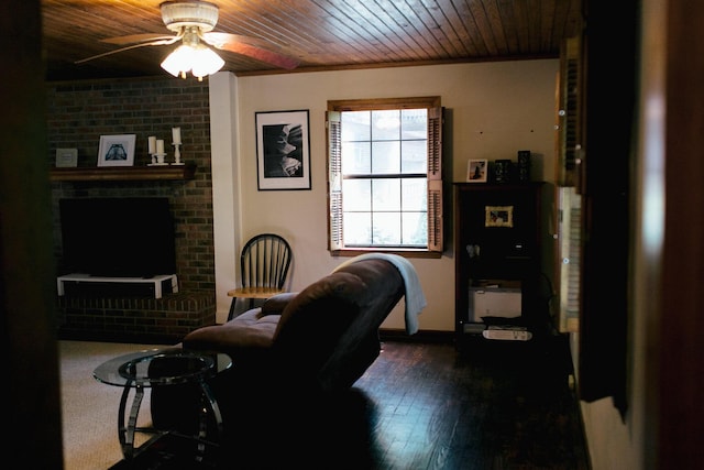 interior space featuring ceiling fan, wood ceiling, and dark wood-type flooring