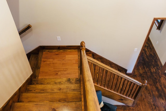 stairway featuring hardwood / wood-style floors