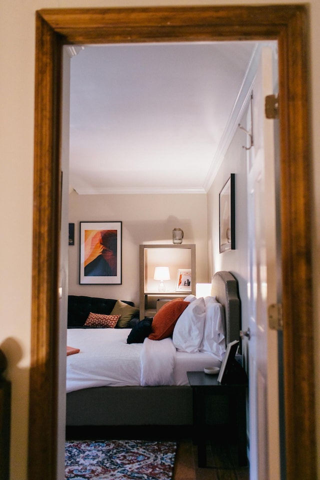 bedroom with ornamental molding