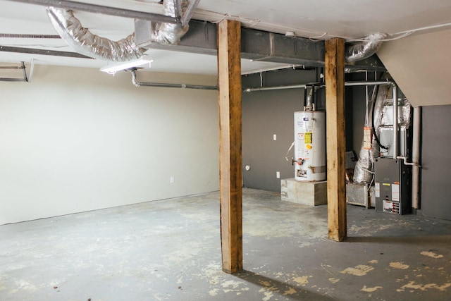 basement featuring heating unit and water heater