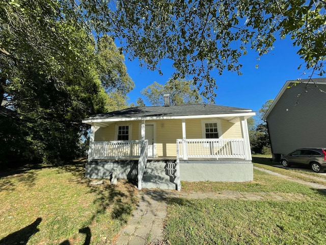 view of front of house with a front lawn and a porch