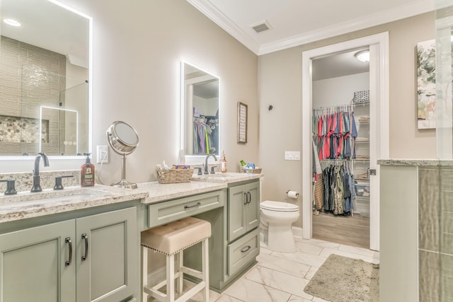 bathroom featuring ornamental molding, a shower, vanity, and toilet