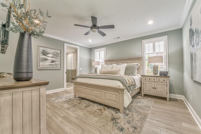 bedroom with ceiling fan, ornamental molding, and light hardwood / wood-style floors