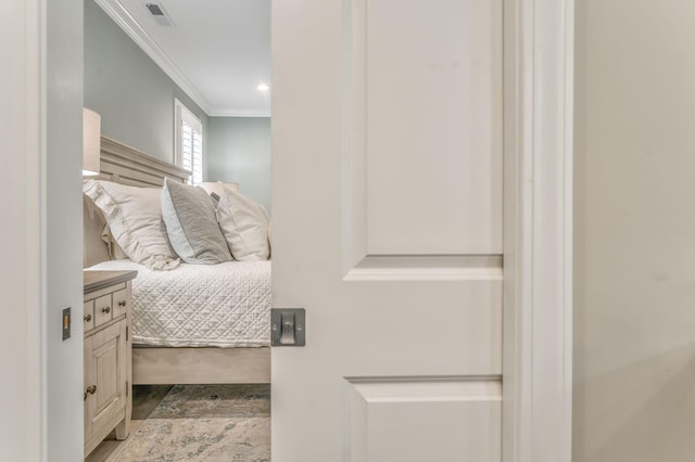 bedroom featuring crown molding