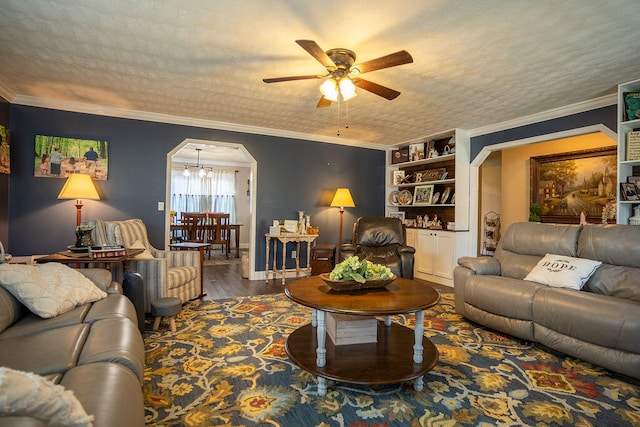 living room featuring a textured ceiling, dark hardwood / wood-style floors, crown molding, and ceiling fan with notable chandelier