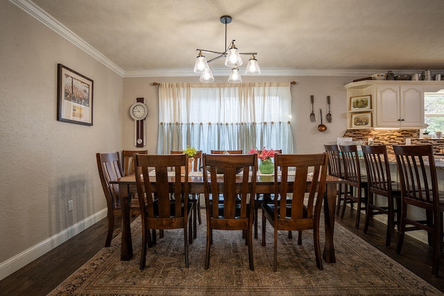 dining room with a notable chandelier, dark hardwood / wood-style floors, and ornamental molding