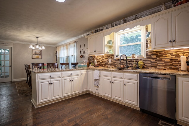 kitchen featuring dishwasher, sink, dark wood-type flooring, decorative light fixtures, and white cabinets