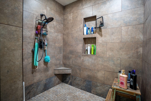 bathroom with tiled shower