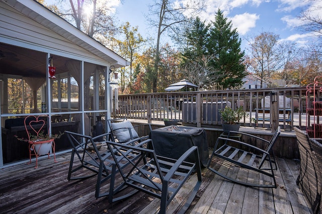 wooden terrace featuring a sunroom