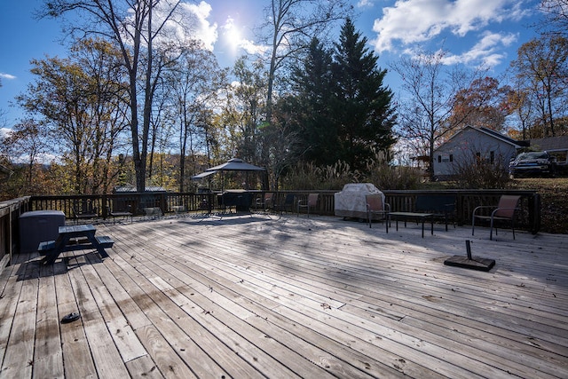 wooden deck featuring a gazebo