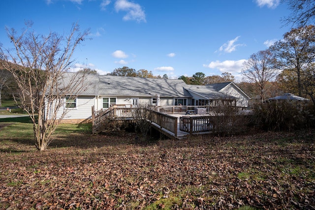 rear view of house with a deck