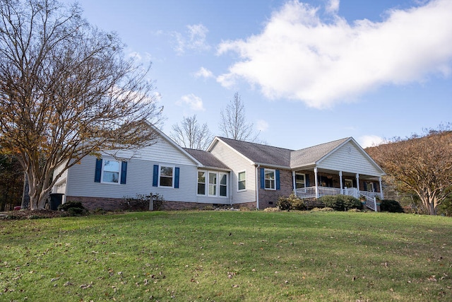 view of front of property with a front yard and a porch