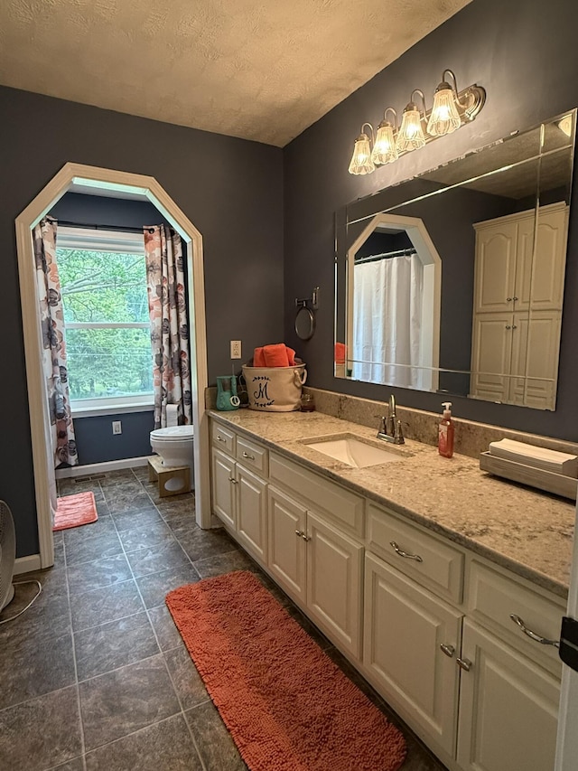 30 Meadowbrook Ln, Trenton, GA 30752 - bathroom with a textured ceiling, toilet, vanity, baseboards, and a shower with curtain