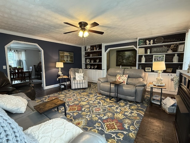 30 Meadowbrook Ln, Trenton, GA 30752 - living area featuring wood finished floors, a ceiling fan, arched walkways, built in features, and ornamental molding