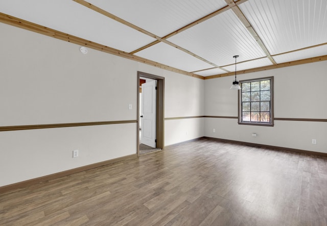 unfurnished room featuring hardwood / wood-style flooring