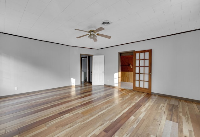 empty room with light hardwood / wood-style floors, ceiling fan, and ornamental molding