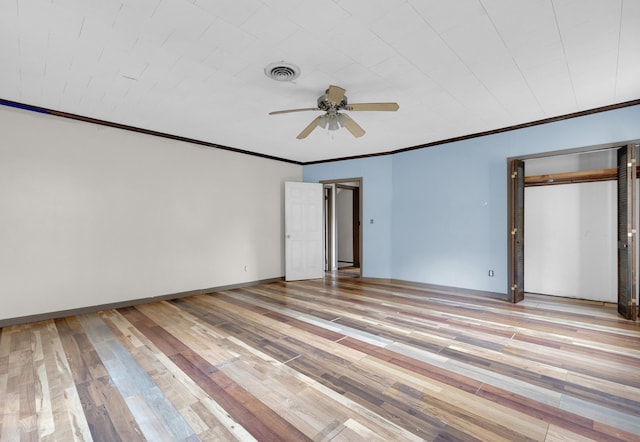 spare room with ceiling fan, crown molding, and light hardwood / wood-style flooring