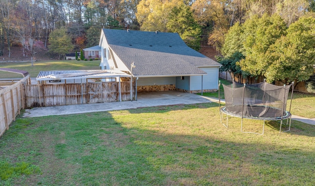 view of yard featuring a patio area and a trampoline