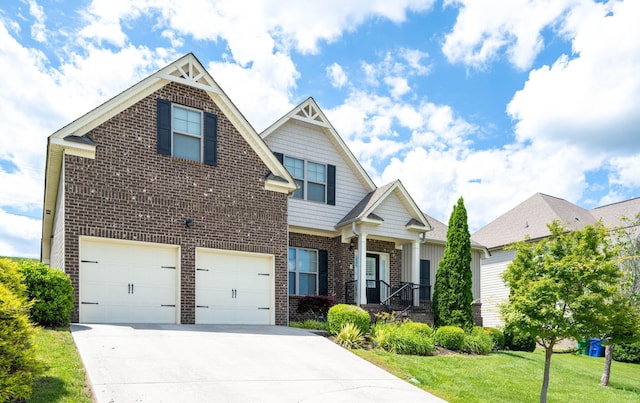 craftsman inspired home with a garage and a front lawn