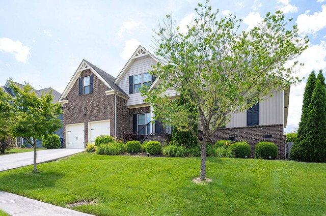 view of front of house featuring a garage and a front lawn