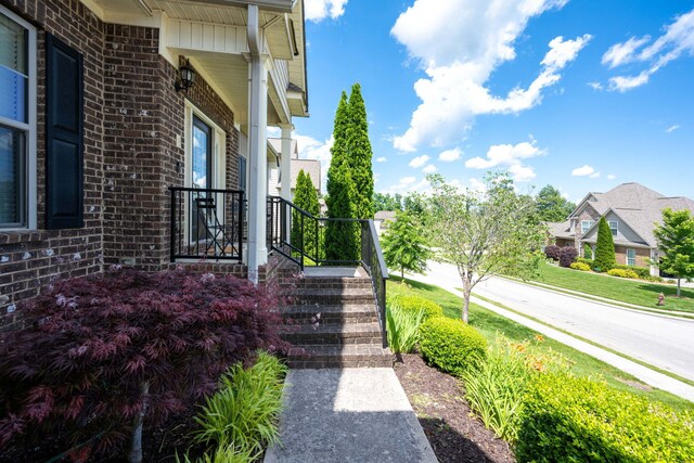 view of property exterior featuring a porch