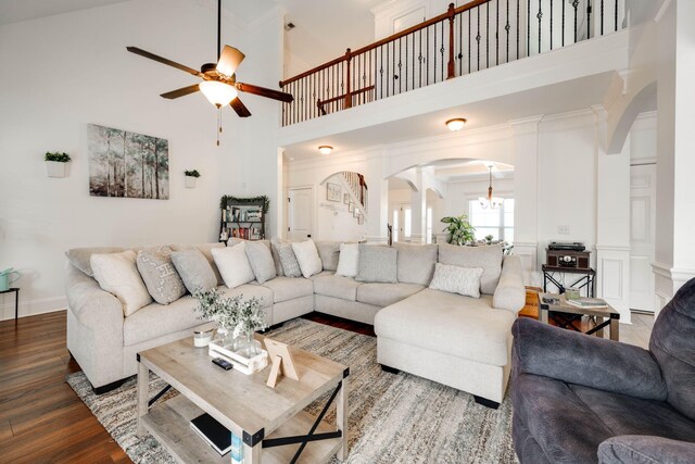 living room featuring ceiling fan, hardwood / wood-style floors, and high vaulted ceiling