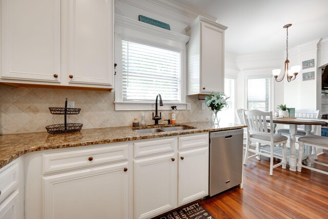 kitchen with dishwasher, white cabinets, hardwood / wood-style floors, and sink