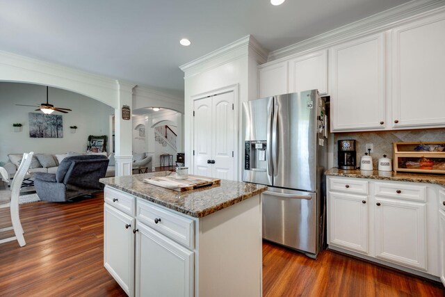 kitchen featuring stainless steel fridge, dark hardwood / wood-style floors, white cabinetry, and ceiling fan