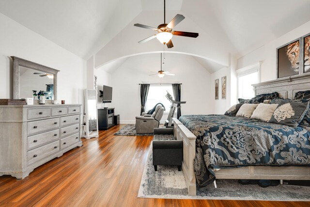 bedroom with ceiling fan, hardwood / wood-style floors, and lofted ceiling