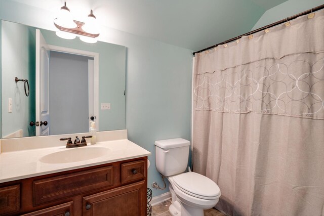 bathroom featuring tile patterned floors, vanity, and toilet