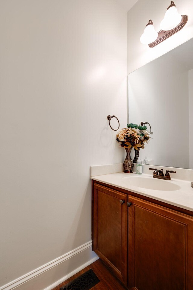 bathroom featuring hardwood / wood-style floors and vanity