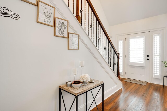 foyer entrance with dark wood-type flooring