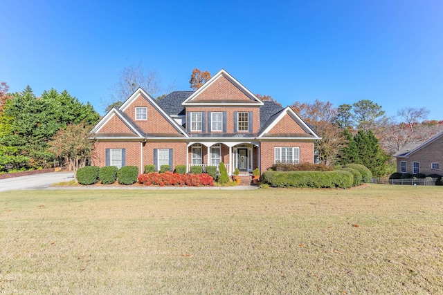 craftsman-style house featuring a front yard and a porch