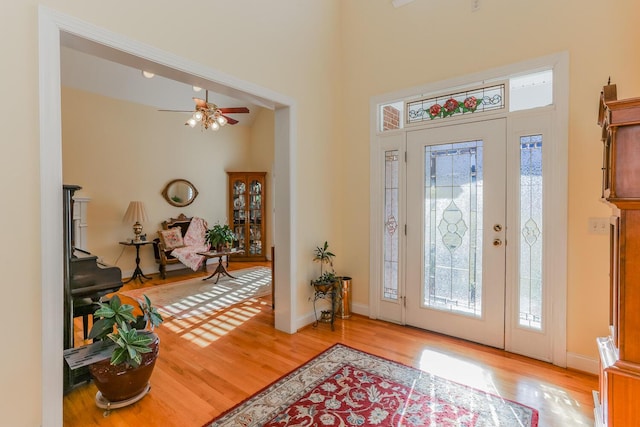 foyer featuring light wood-type flooring and ceiling fan