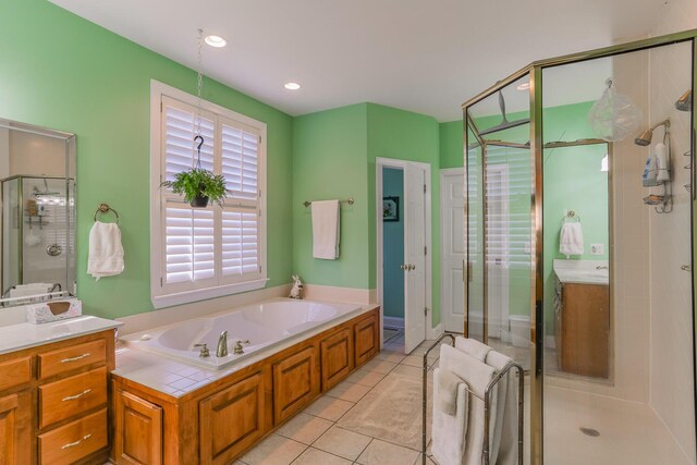 289 Magnolia Pl, Ringgold, GA 30736 - bathroom featuring a stall shower, vanity, a bath, and tile patterned flooring