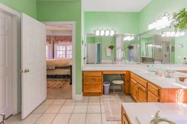 bathroom featuring tile patterned flooring, vanity, and independent shower and bath