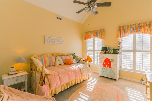 bedroom with carpet floors, vaulted ceiling, multiple windows, and ceiling fan