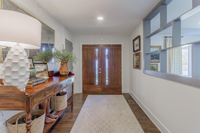 foyer with dark wood-type flooring