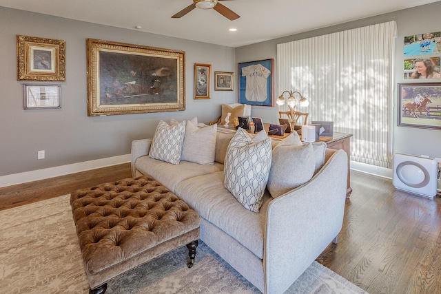 living room with hardwood / wood-style floors and ceiling fan