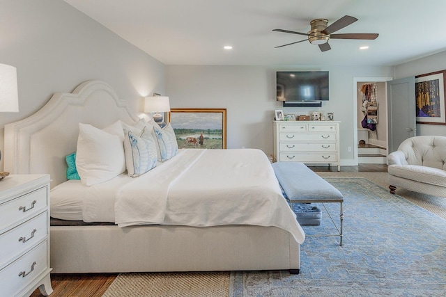 bedroom featuring ceiling fan and light hardwood / wood-style flooring