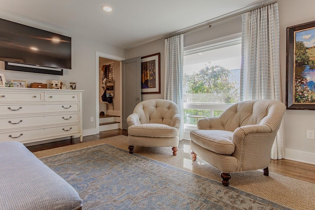 living area with hardwood / wood-style flooring