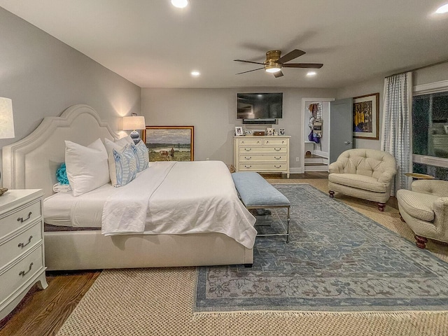 bedroom featuring ceiling fan and dark hardwood / wood-style flooring