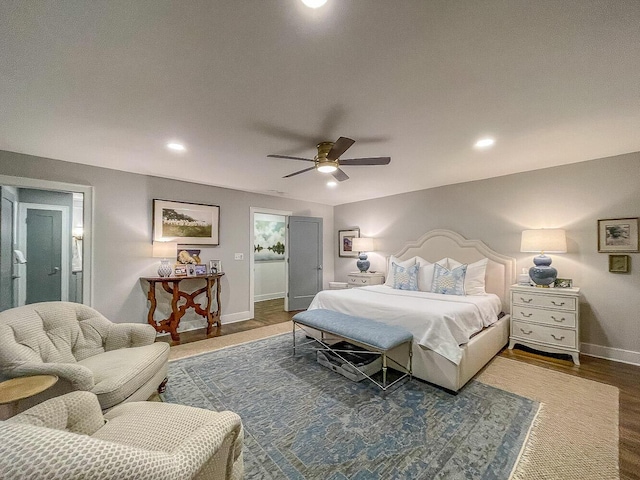 bedroom with dark hardwood / wood-style flooring and ceiling fan