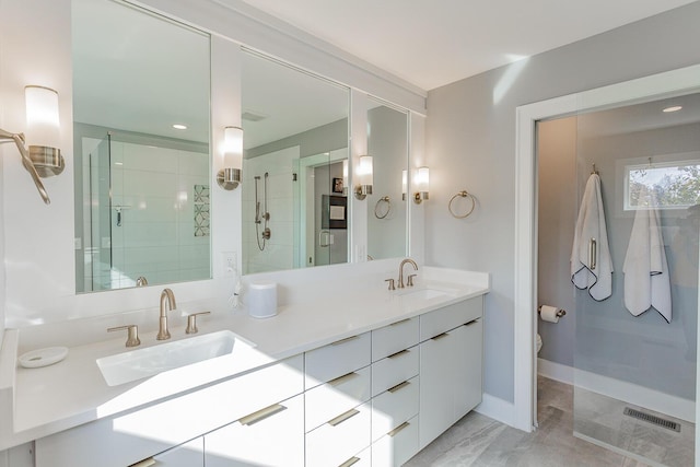 bathroom with vanity, a shower with shower door, and toilet