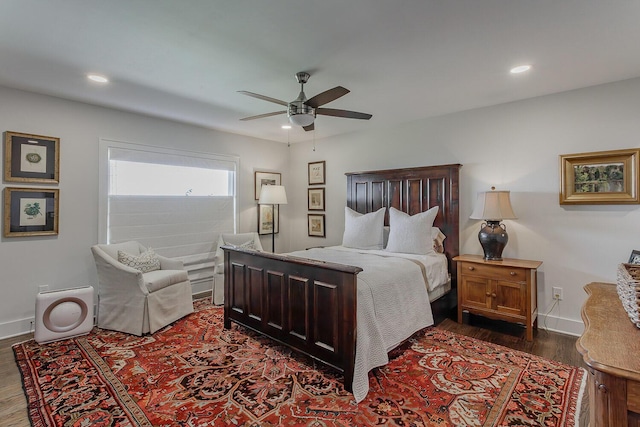 bedroom with ceiling fan and dark wood-type flooring